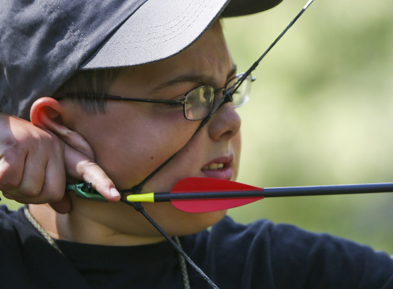 Sheldon Little, 11, draws back his arrow before releasing